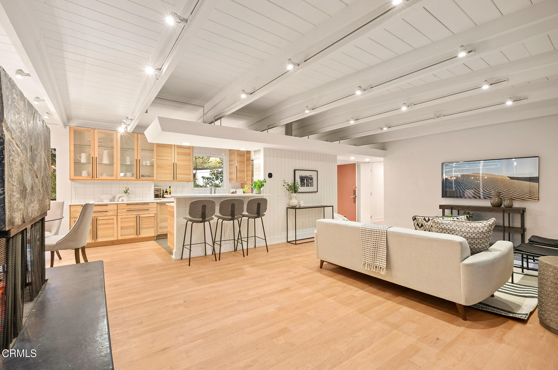 911 Laguna Road Pasadena, CA 91105 - Photo 8 of 34 a living room with furniture and a dining table with kitchen view