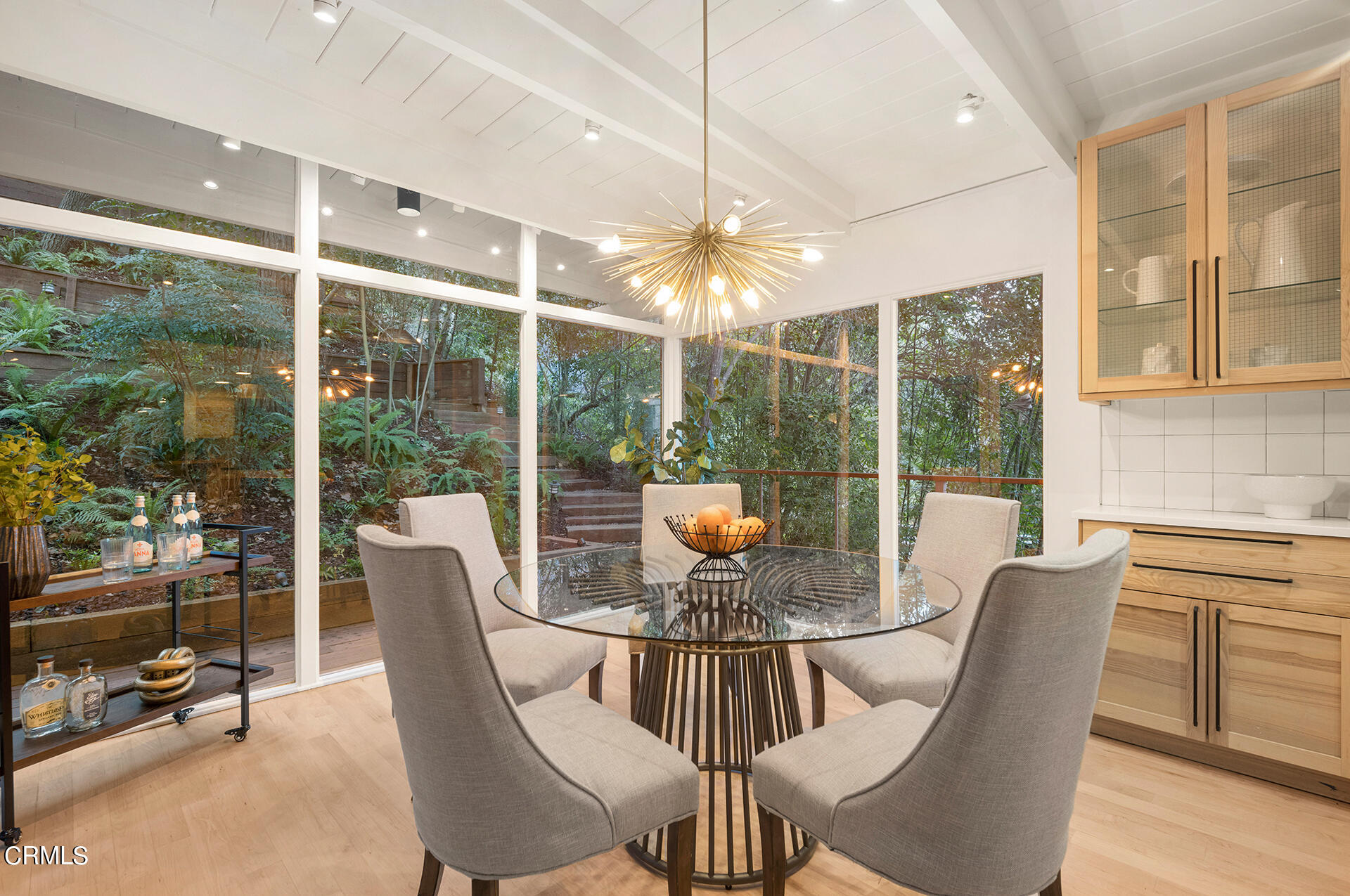 911 Laguna Road Pasadena, CA 91105 - Photo 10 of 34 a view of a dining room with furniture window and outside view