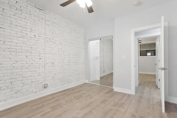an empty room with a empty space and windows