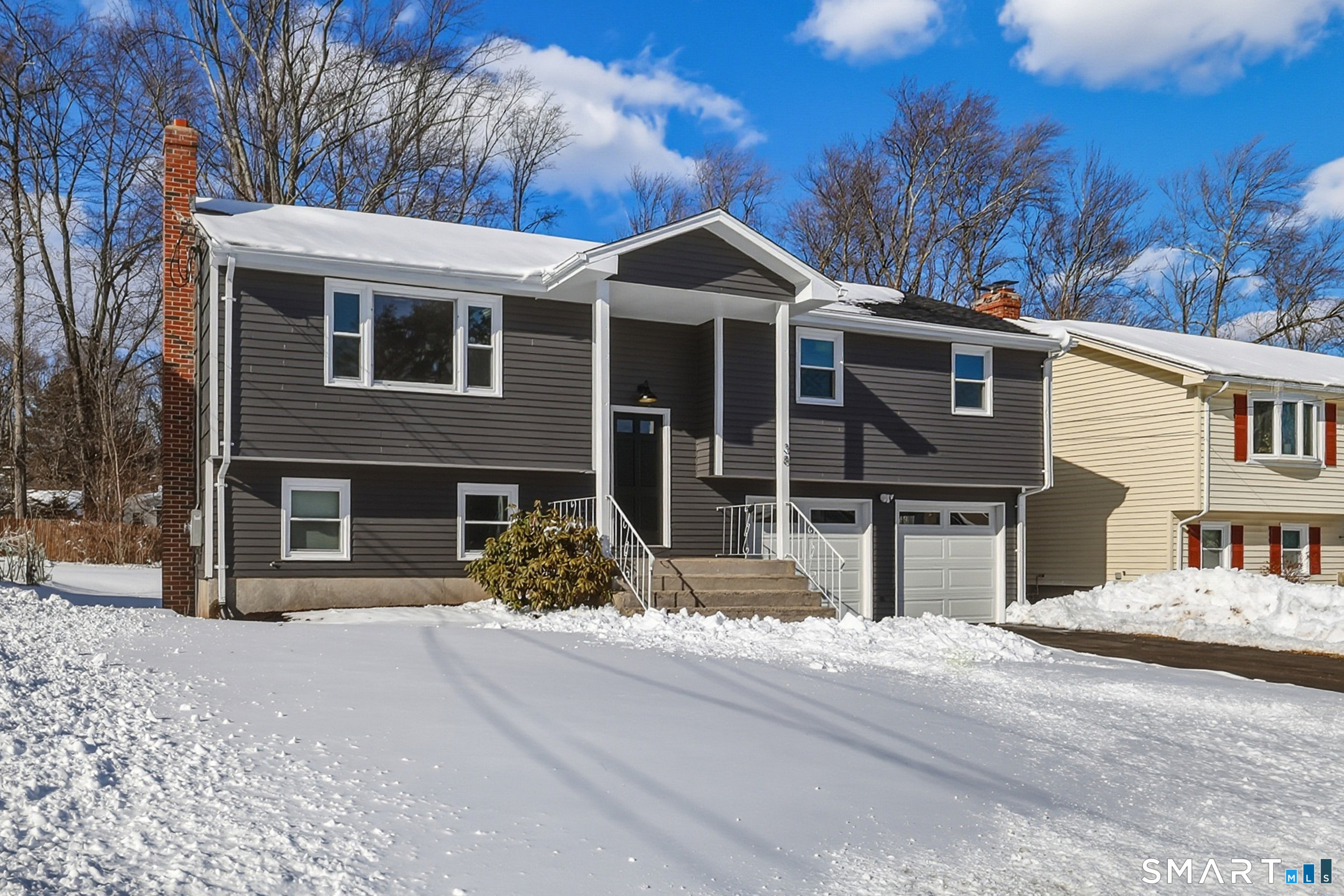 38 Mildred Road West Hartford, CT 06107 - Photo 1 of 35 a front view of a house with a yard