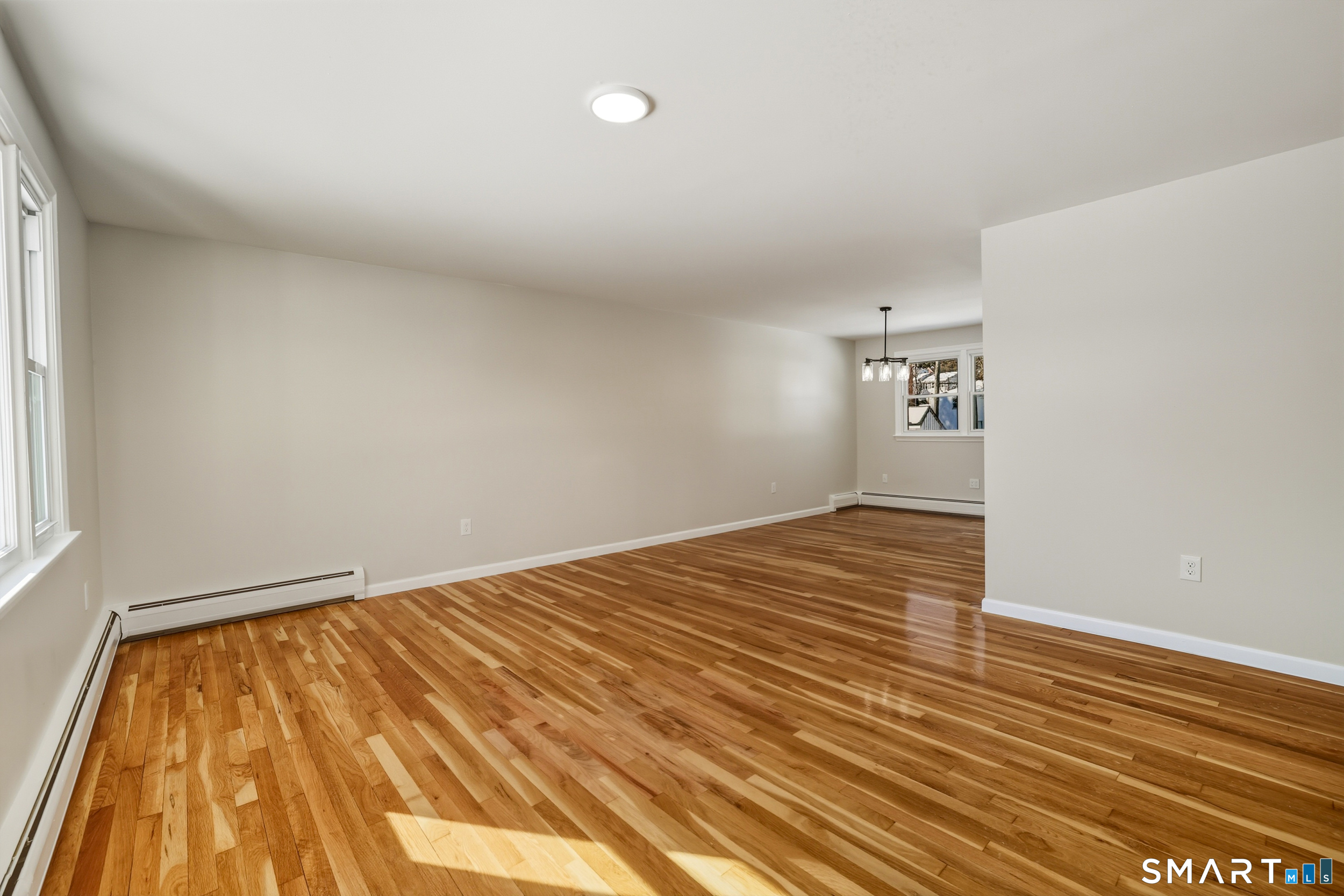 38 Mildred Road West Hartford, CT 06107 - Photo 13 of 35 a view of empty room with wooden floor