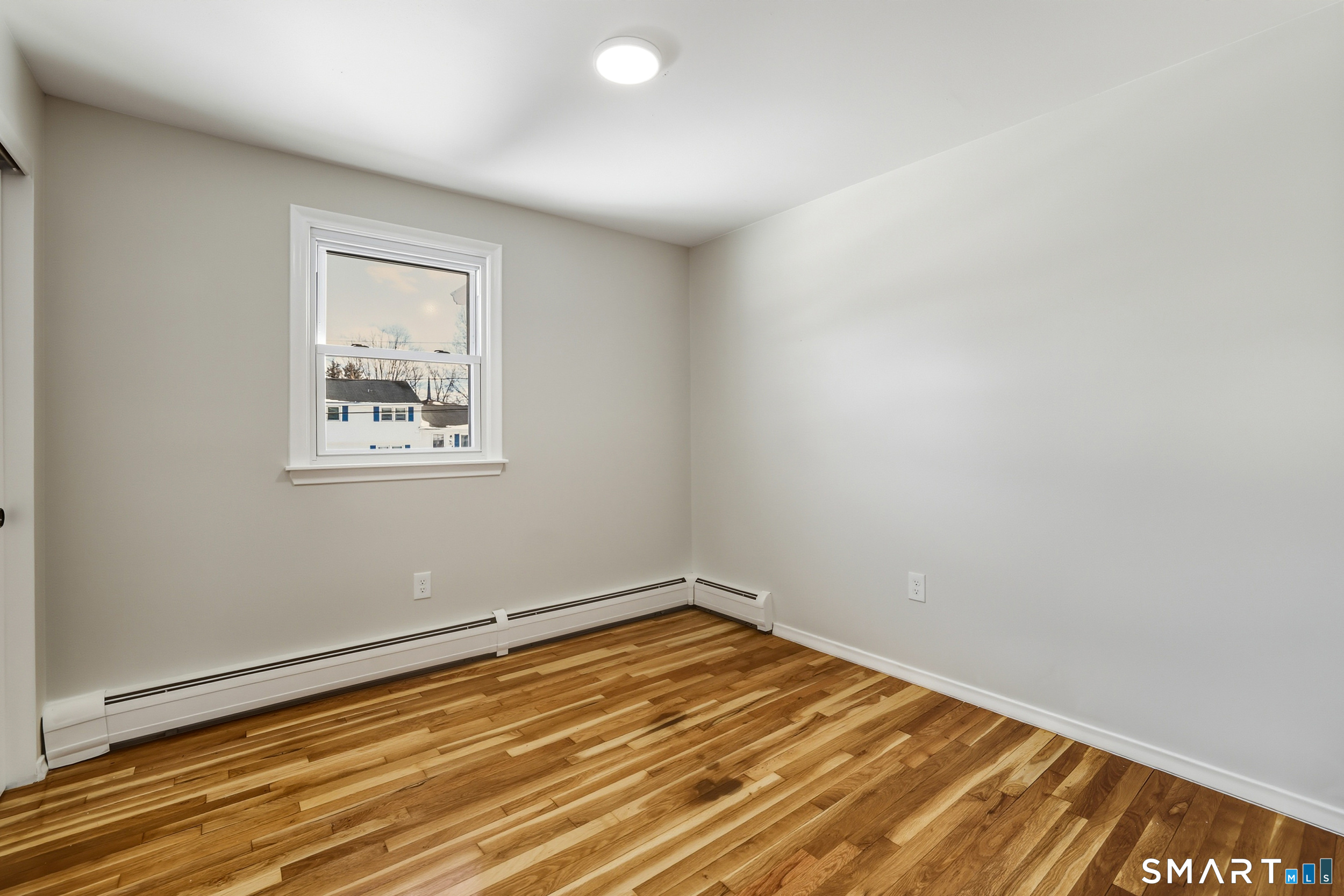 38 Mildred Road West Hartford, CT 06107 - Photo 19 of 35 a view of empty room with wooden floor