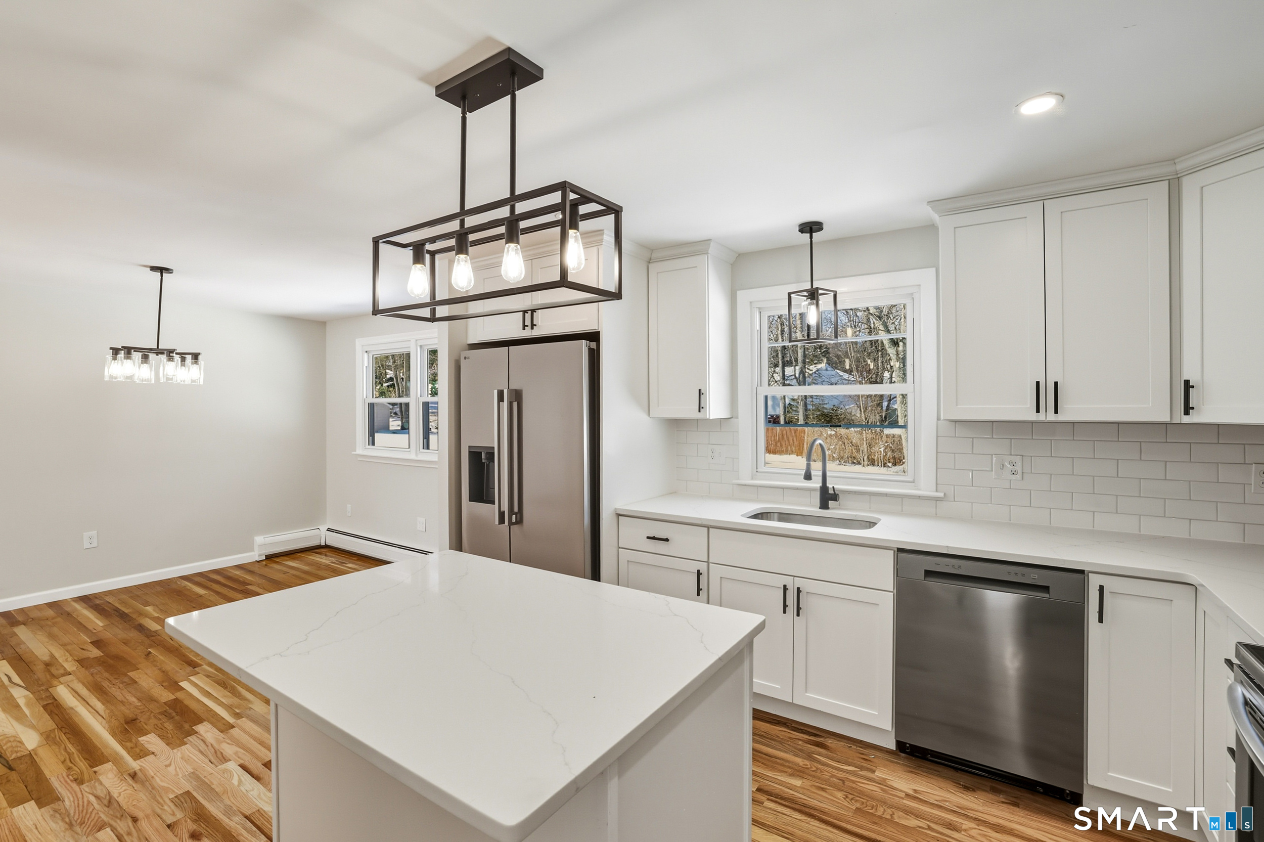 38 Mildred Road West Hartford, CT 06107 - Photo 2 of 35 a kitchen with a stove a sink cabinetry and a chandelier