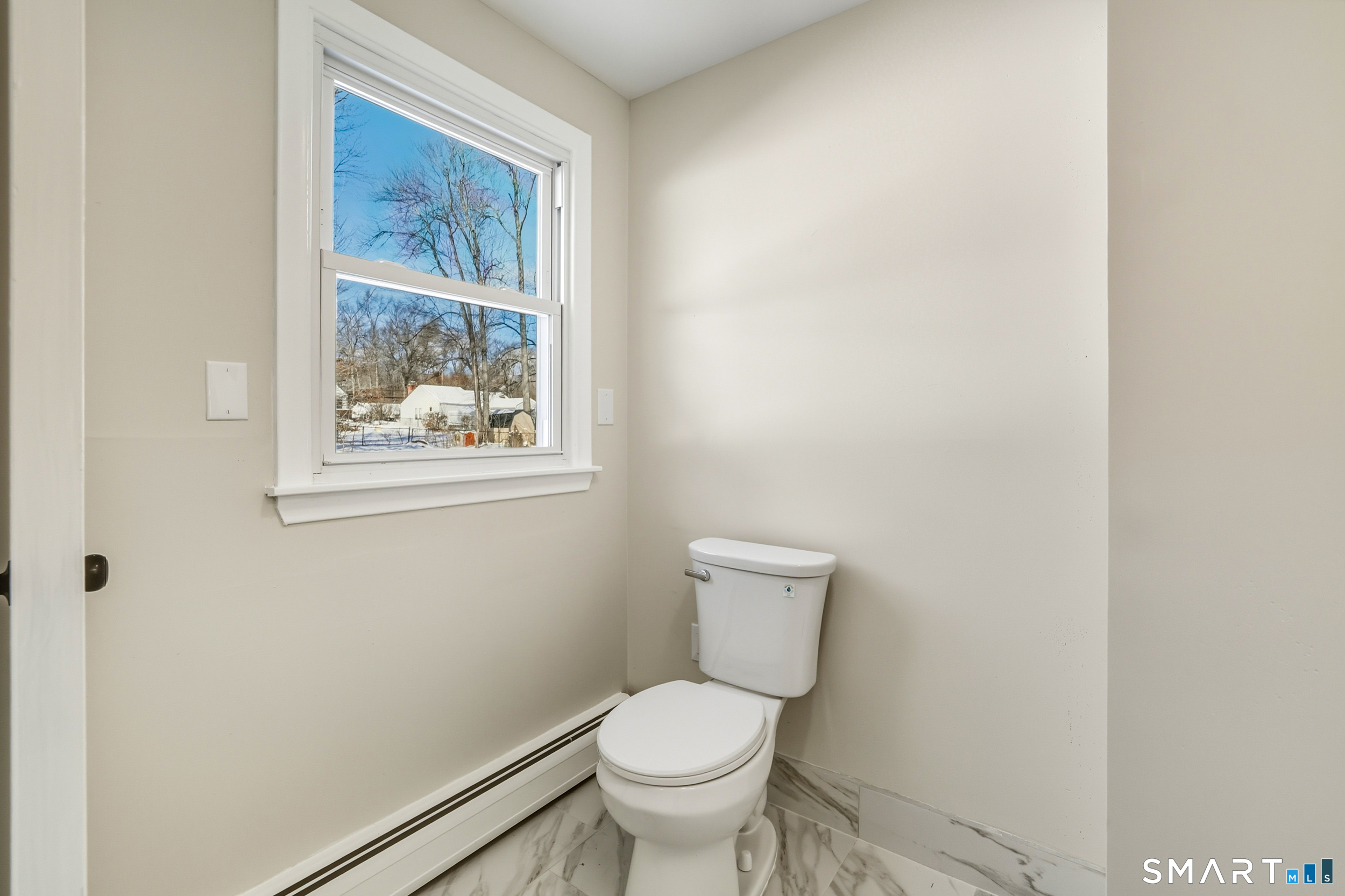 38 Mildred Road West Hartford, CT 06107 - Photo 29 of 35 a white toilet sitting next to a window