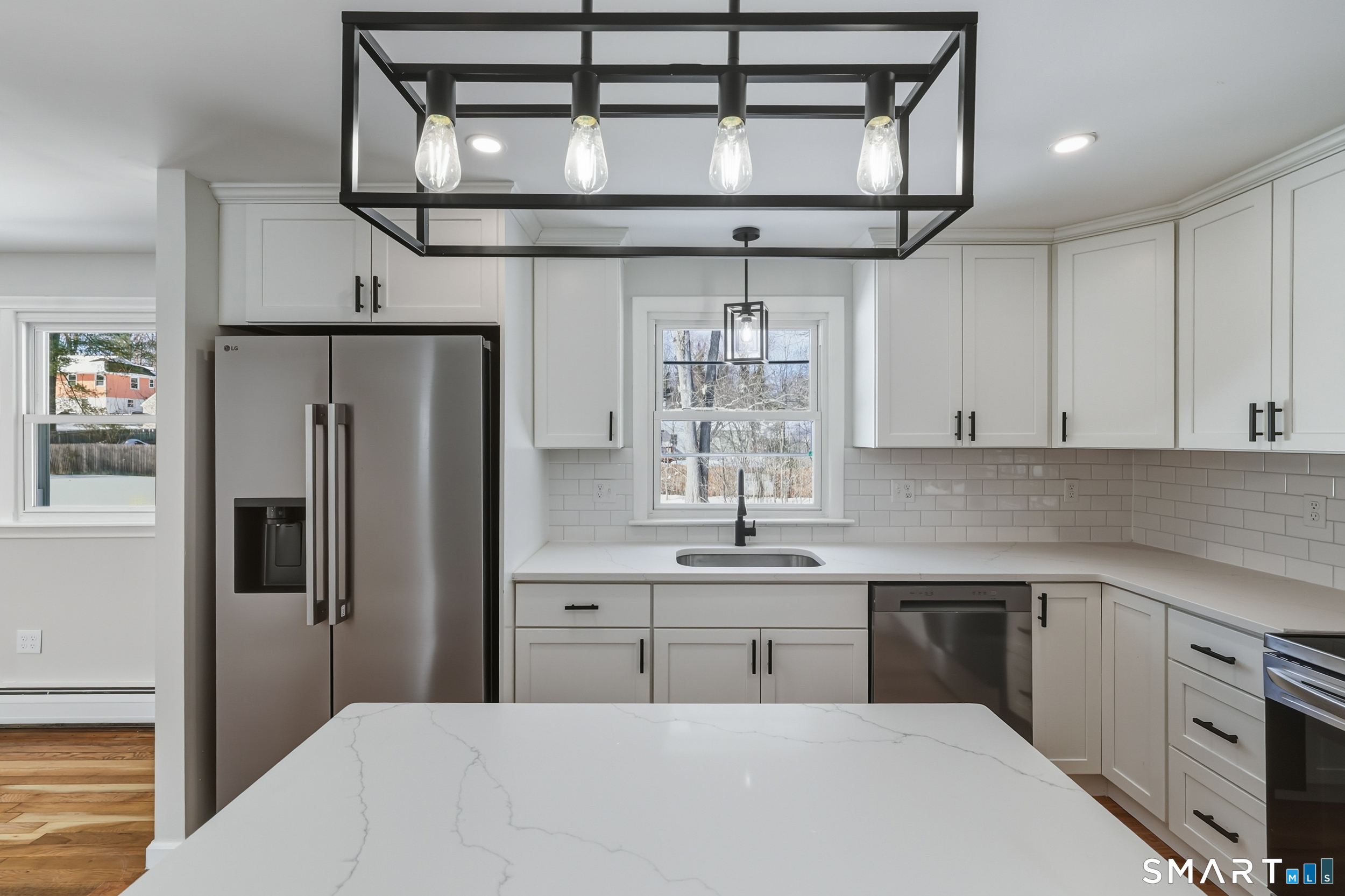 38 Mildred Road West Hartford, CT 06107 - Photo 4 of 35 a kitchen with stainless steel appliances a sink and a refrigerator