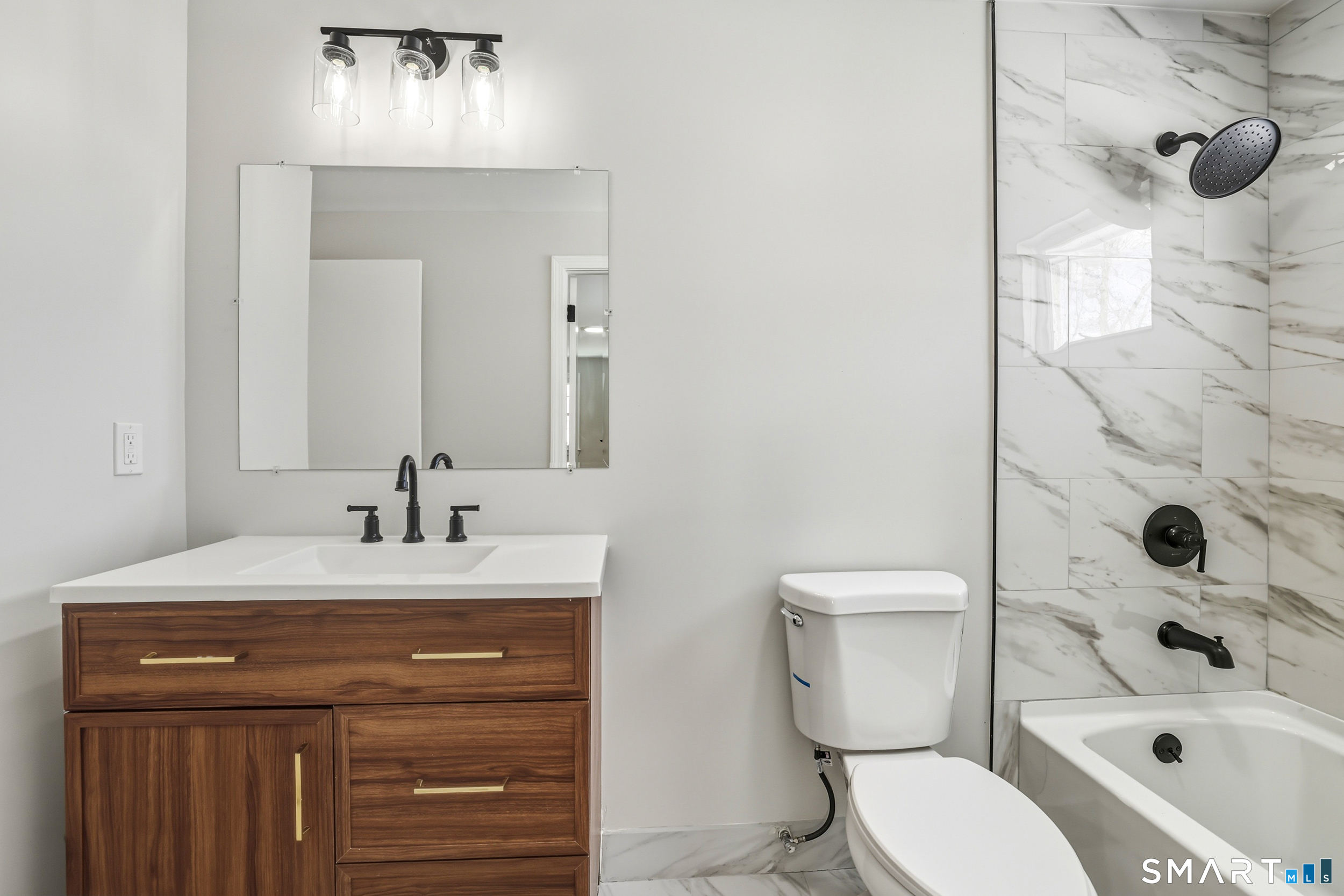 38 Mildred Road West Hartford, CT 06107 - Photo 6 of 35 a bathroom with a sink a toilet and shower