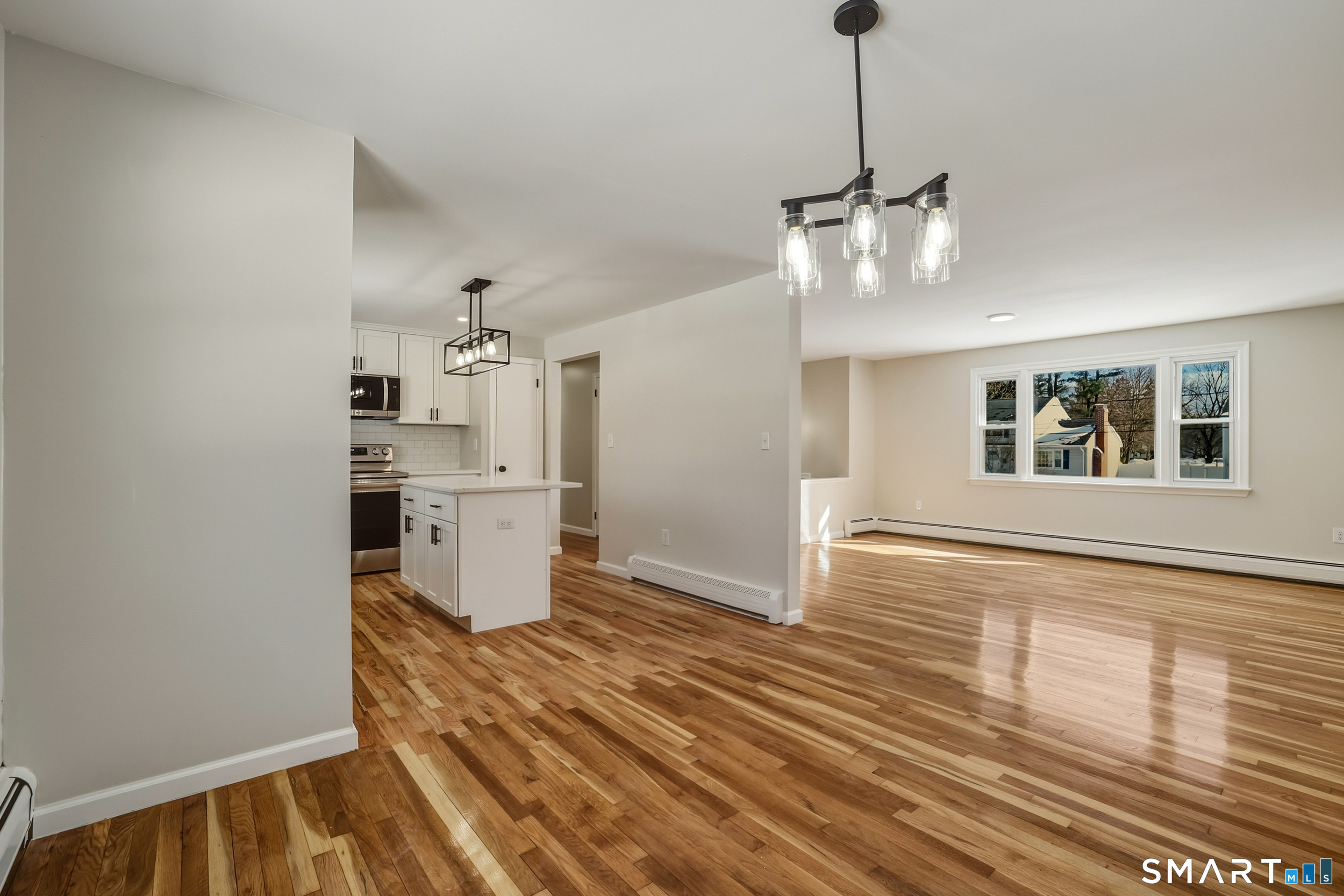 38 Mildred Road West Hartford, CT 06107 - Photo 9 of 35 a view of a room with wooden floor and windows