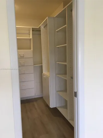 a view of an empty walk in closet