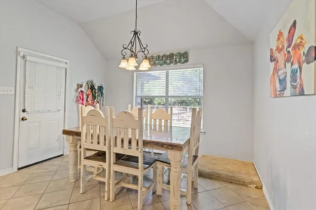 a view of a dining room with furniture window and chandelier