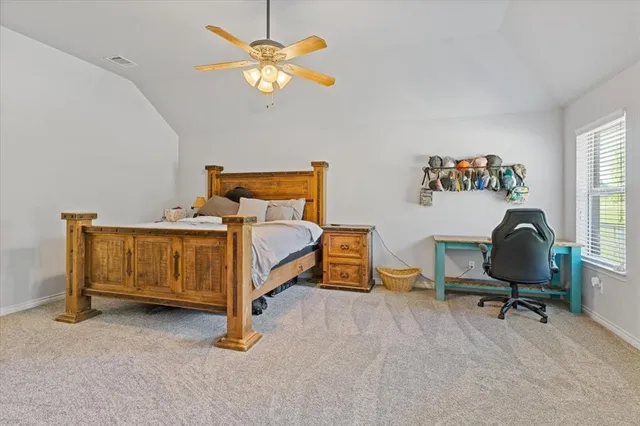 a bedroom with a workspace