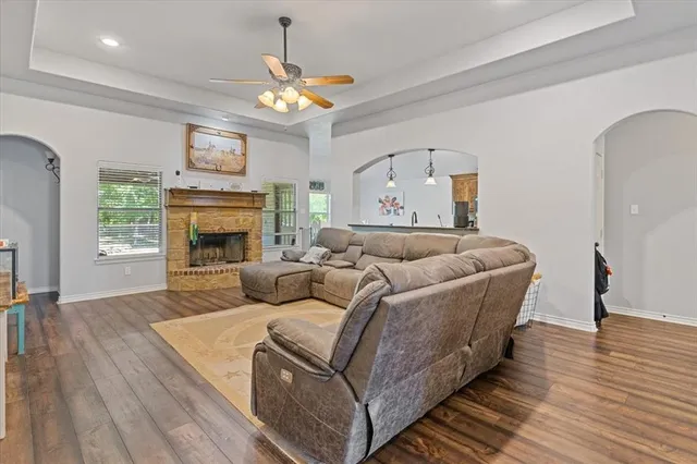 a living room with furniture and a fireplace