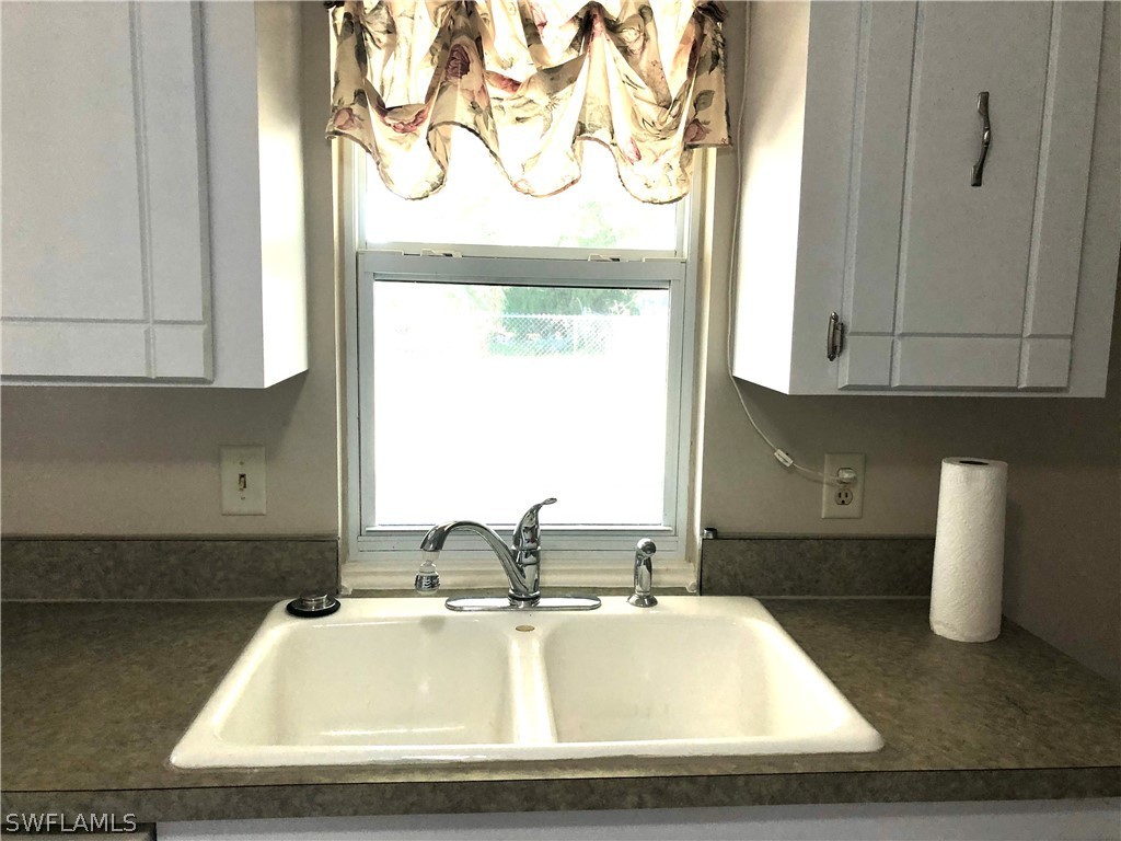7356 Barragan Road Fort Myers, FL 33967 - Photo 6 of 23 a view of a kitchen with a sink and cabinets