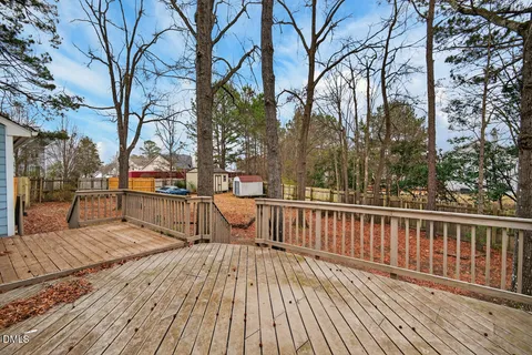 a view of deck with wooden floor and fence