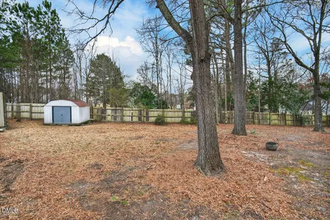 a backyard of a house with lots of green space