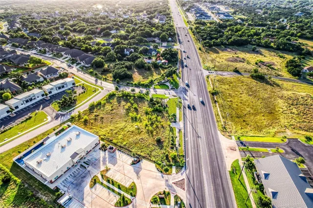 an aerial view of a residential houses with outdoor space