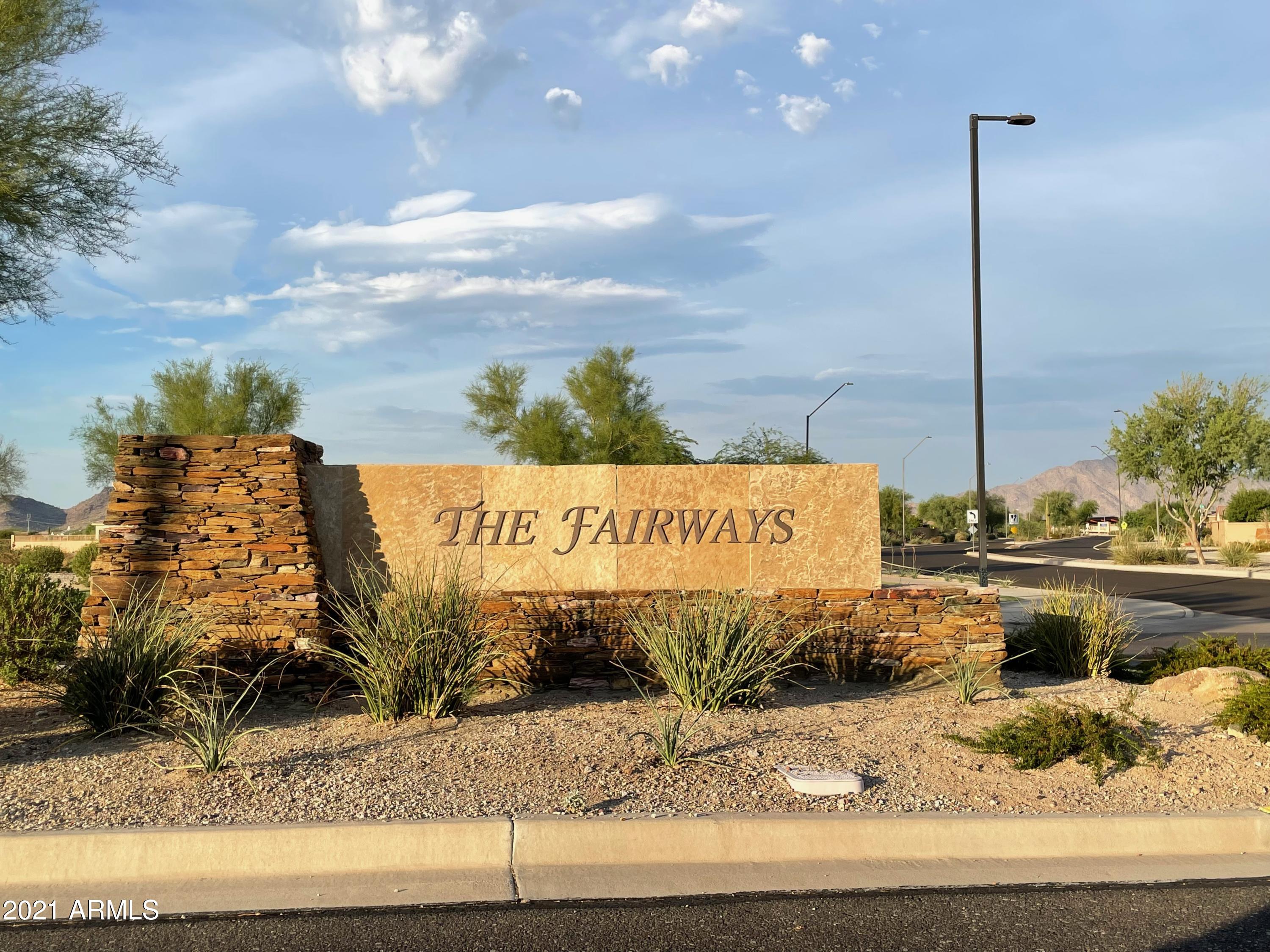 17984 West Narramore Road Goodyear, AZ 85338 - Photo 1 of 149 a sign on the side of a road