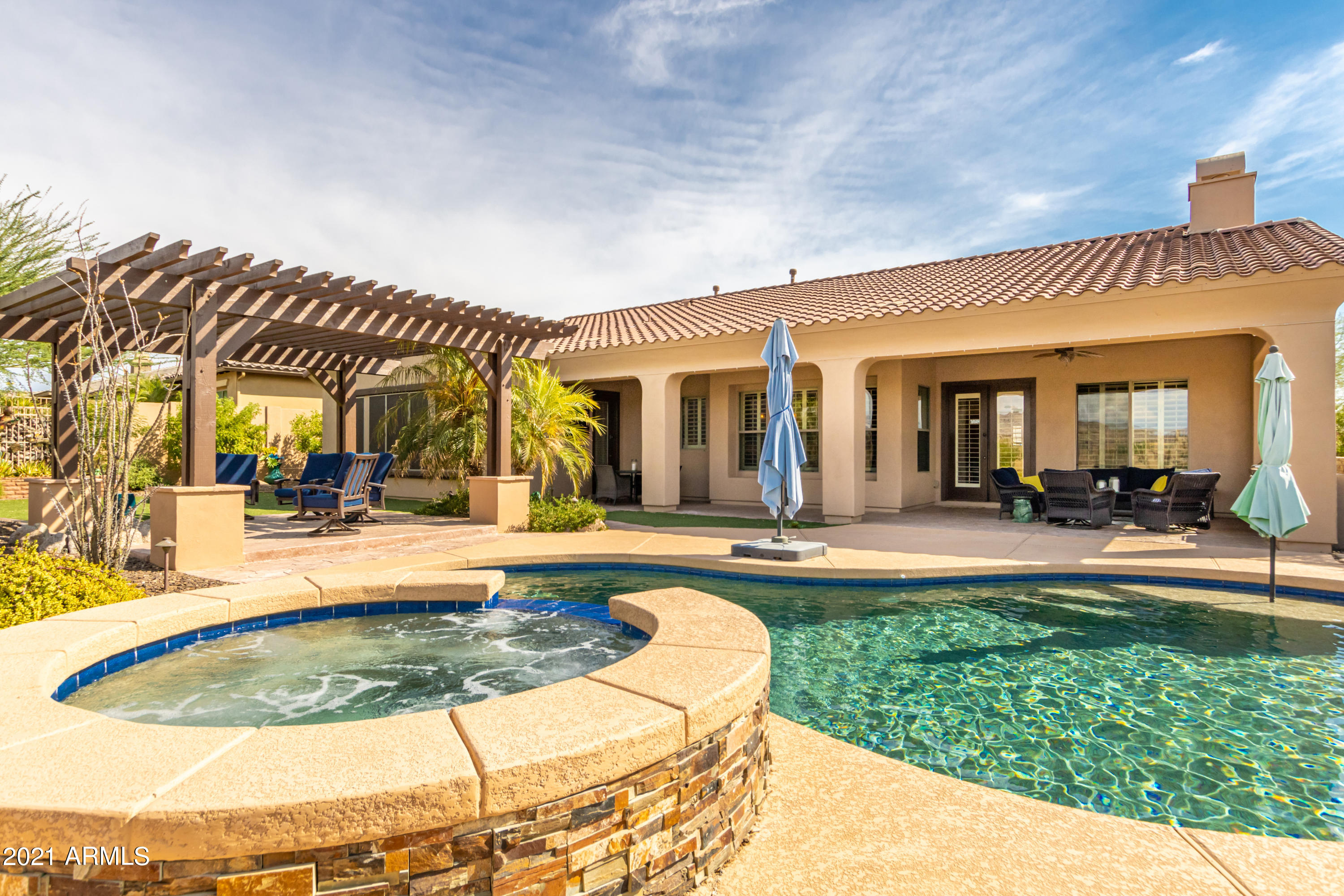 17984 West Narramore Road Goodyear, AZ 85338 - Photo 121 of 149 a view of a house with swimming pool and sitting area