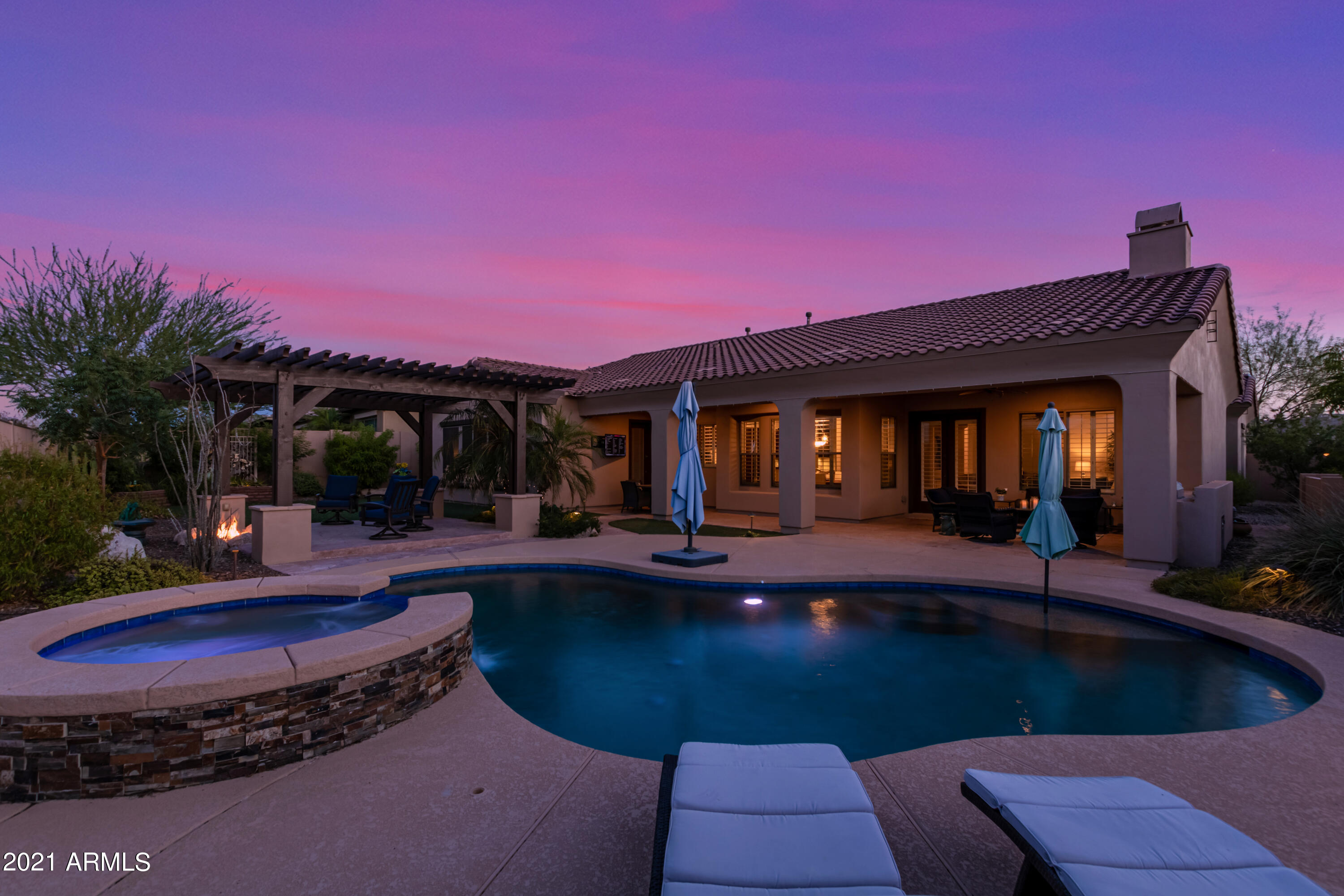 17984 West Narramore Road Goodyear, AZ 85338 - Photo 19 of 149 a view of a house with swimming pool and sitting area