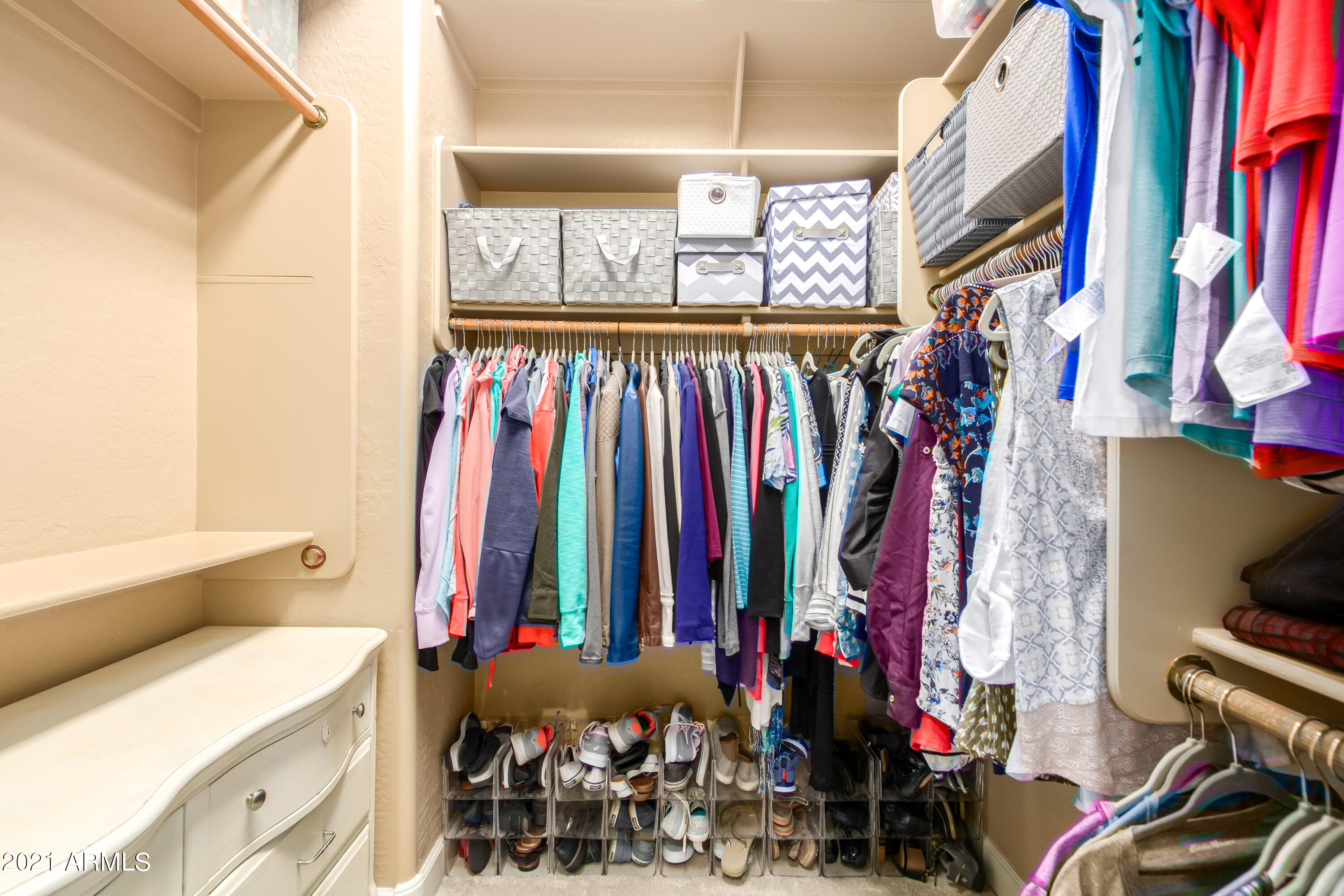 17984 West Narramore Road Goodyear, AZ 85338 - Photo 66 of 149 a view of walk in closet with clothes and shoes