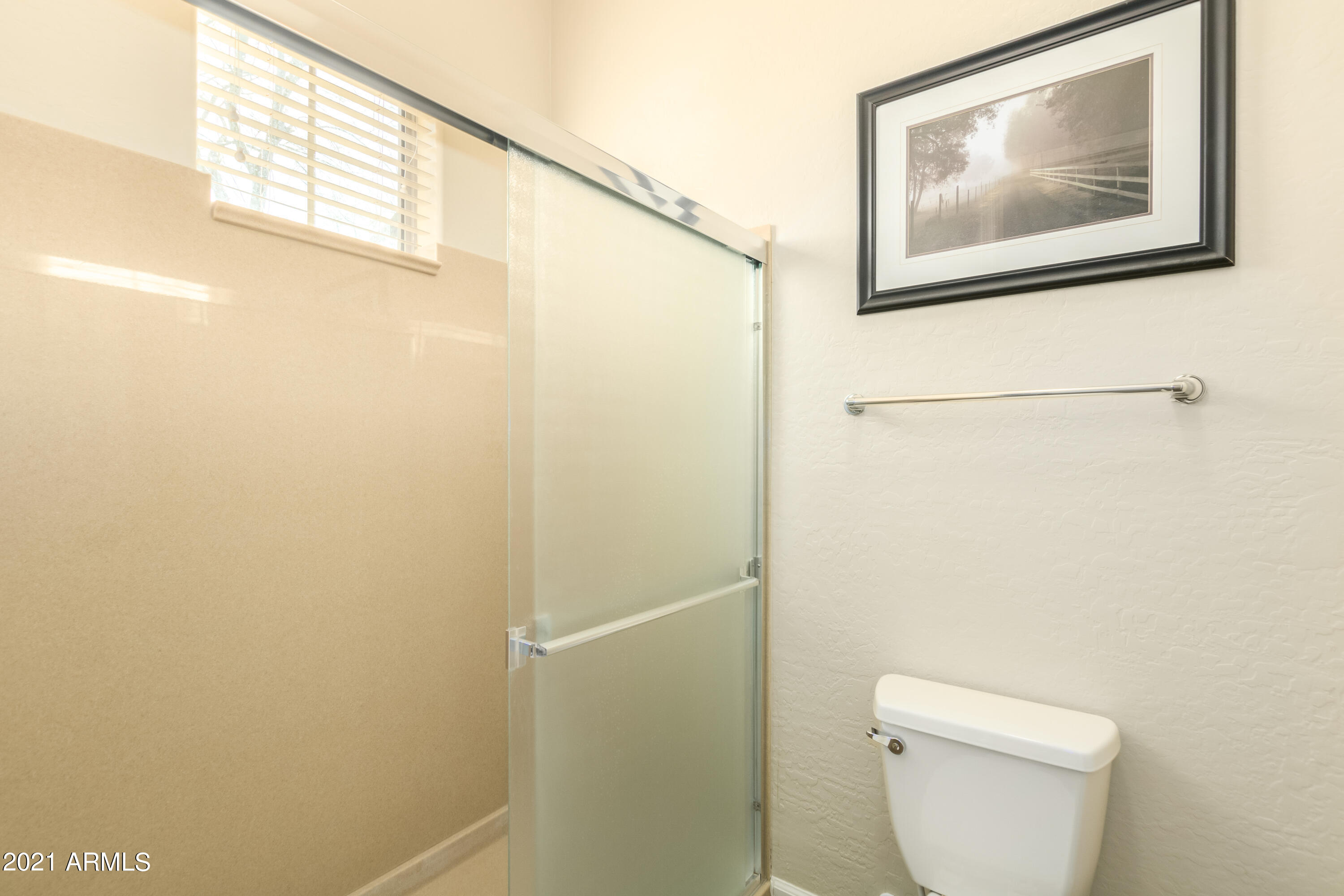 17984 West Narramore Road Goodyear, AZ 85338 - Photo 74 of 149 a bathroom with a toilet and a shower