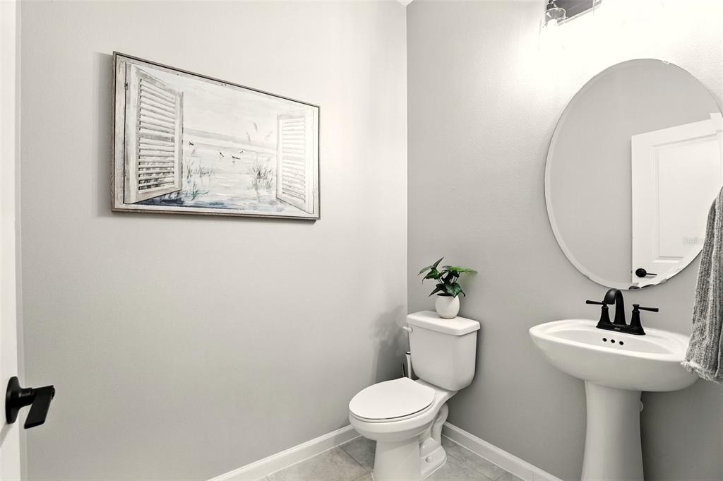 726 Porter Rye Avenue DeBary, FL 32713 - Photo 14 of 44 a bathroom with a sink mirror and toilet