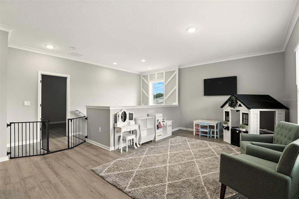 726 Porter Rye Avenue DeBary, FL 32713 - Photo 17 of 44 a living room with furniture a flat screen tv and kitchen view