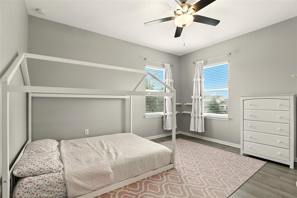 726 Porter Rye Avenue DeBary, FL 32713 - Photo 24 of 44 a bedroom with a bed and a window