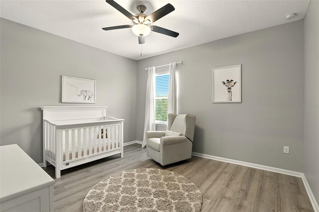 726 Porter Rye Avenue DeBary, FL 32713 - Photo 27 of 44 a bedroom with a bed and a window