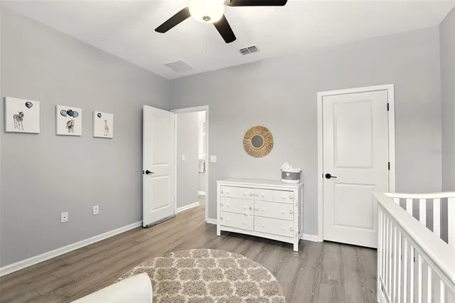 a view of room with wooden floor