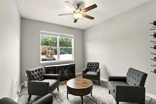 a living room with furniture a window and a fireplace