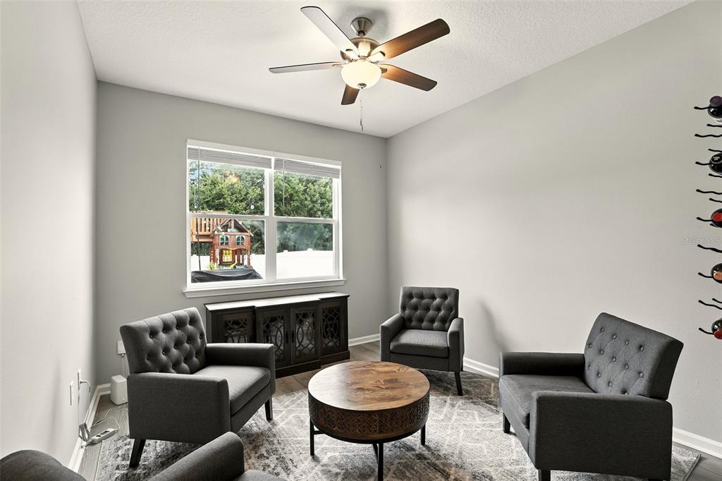 726 Porter Rye Avenue DeBary, FL 32713 - Photo 30 of 44 a living room with furniture a window and a fireplace