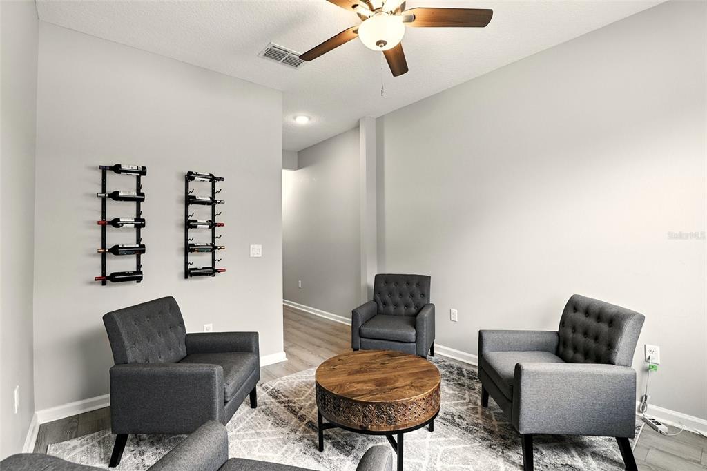 726 Porter Rye Avenue DeBary, FL 32713 - Photo 31 of 44 a living room with furniture and a chair