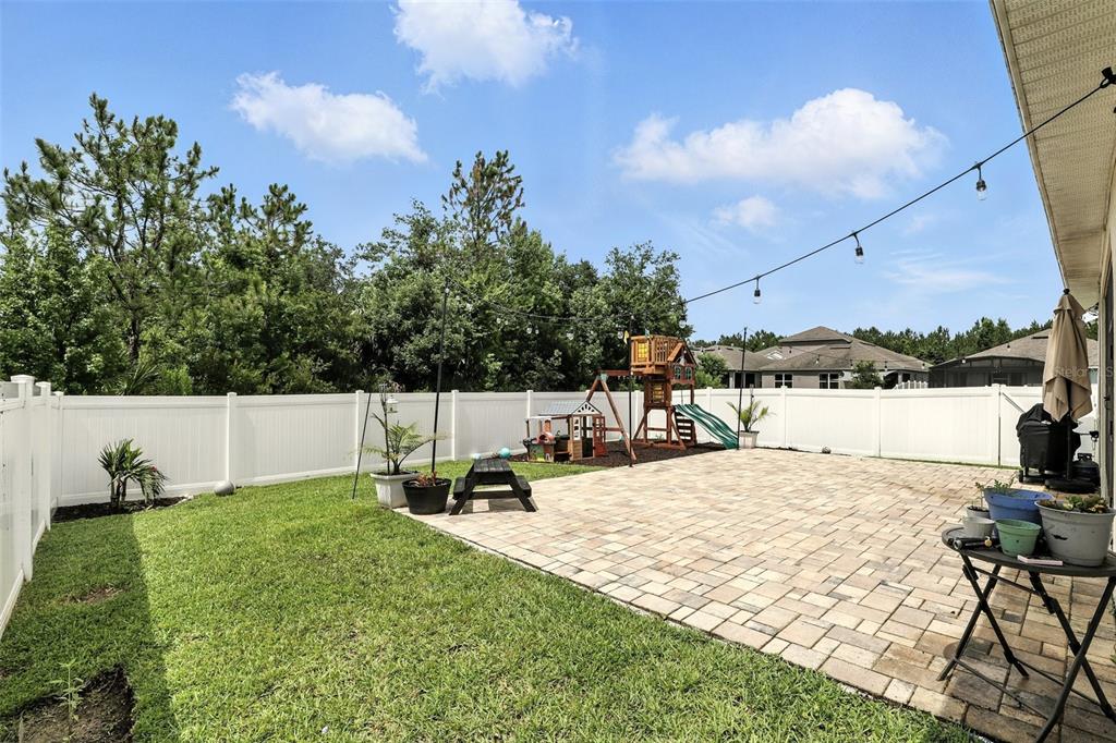 726 Porter Rye Avenue DeBary, FL 32713 - Photo 36 of 44 a view of a swimming pool with a patio