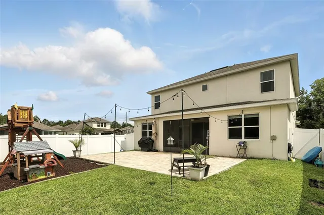 a view of a backyard with a patio