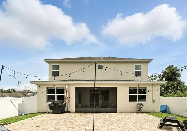 a view of a house with a barbeque