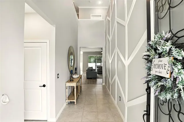 a view of a hallway with paintings on the wall
