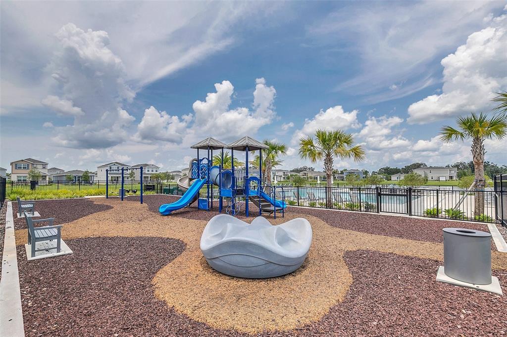 726 Porter Rye Avenue DeBary, FL 32713 - Photo 42 of 44 a view of a swimming pool with a yard and sitting space