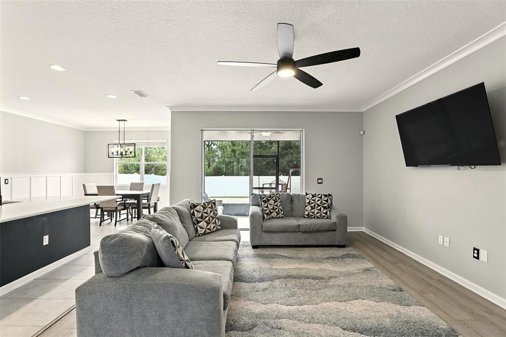 726 Porter Rye Avenue DeBary, FL 32713 - Photo 5 of 44 a living room with furniture and a flat screen tv