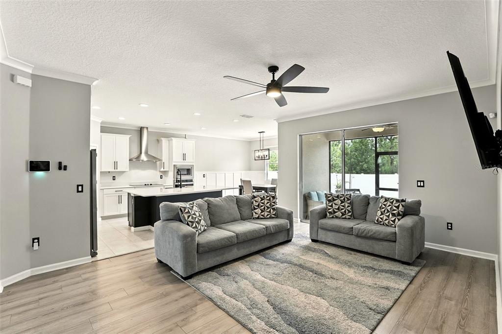 726 Porter Rye Avenue DeBary, FL 32713 - Photo 6 of 44 a living room with furniture and a large window