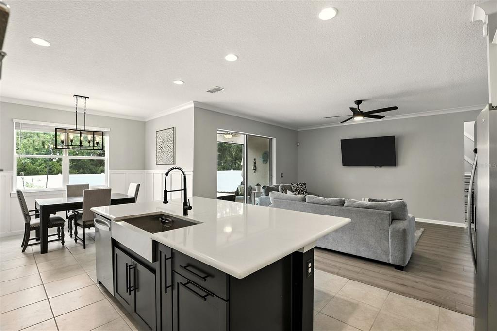 726 Porter Rye Avenue DeBary, FL 32713 - Photo 10 of 44 a kitchen with counter top space appliances and windows