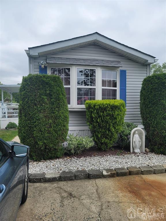 5 Emerson Road North Brunswick, NJ 08902 - Photo 1 of 28 a view of a house with a yard and plants