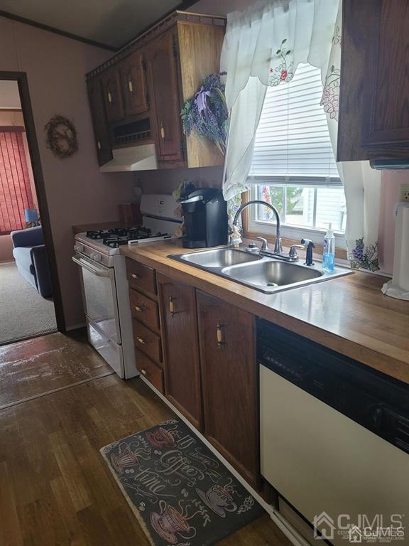5 Emerson Road North Brunswick, NJ 08902 - Photo 12 of 28 a kitchen with stainless steel appliances granite countertop a sink stove and cabinets
