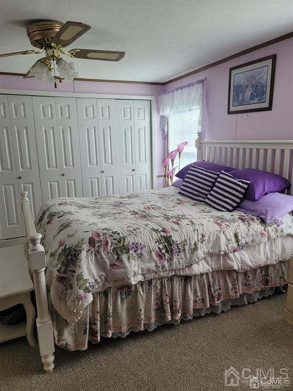 5 Emerson Road North Brunswick, NJ 08902 - Photo 20 of 28 a bedroom with a bed and a chandelier