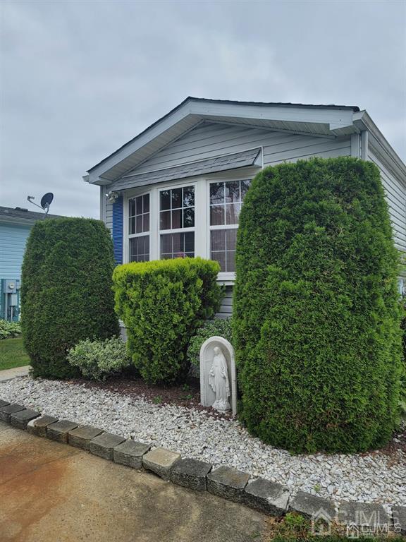 5 Emerson Road North Brunswick, NJ 08902 - Photo 2 of 28 a front view of a house with garden