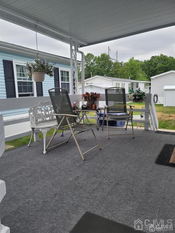 5 Emerson Road North Brunswick, NJ 08902 - Photo 5 of 28 a view of a patio with table and chairs