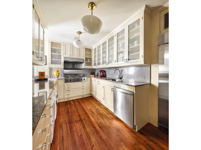 a kitchen with stainless steel appliances granite countertop a stove and a sink