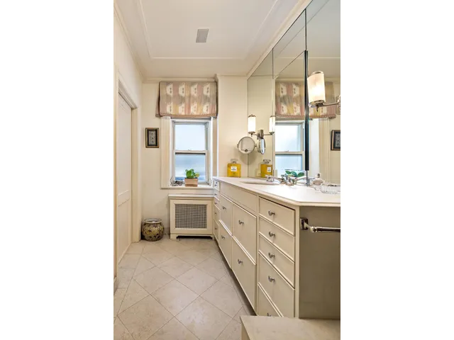 a bathroom with a sink double vanity and a mirror