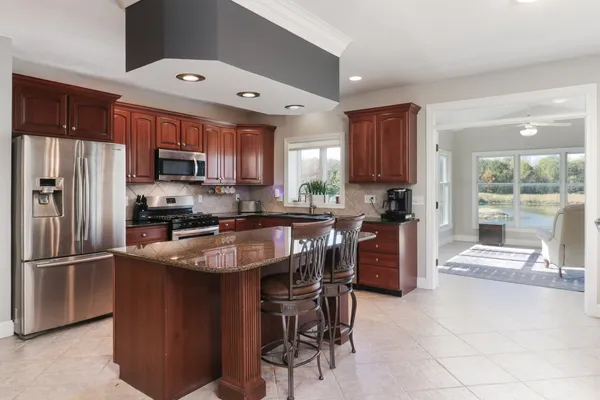 a view of a livingroom with workspace and a window