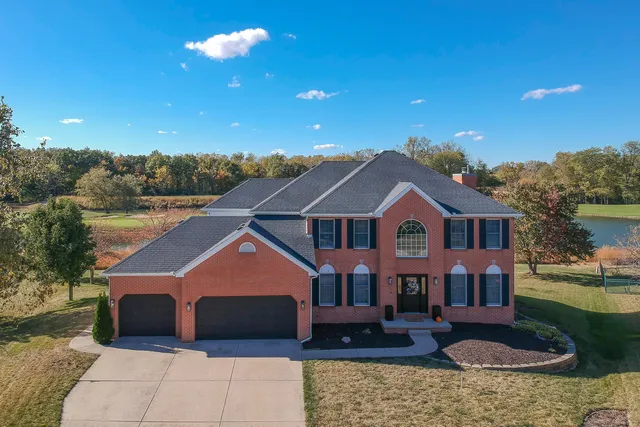a view of entryway and hall with a wooden floor