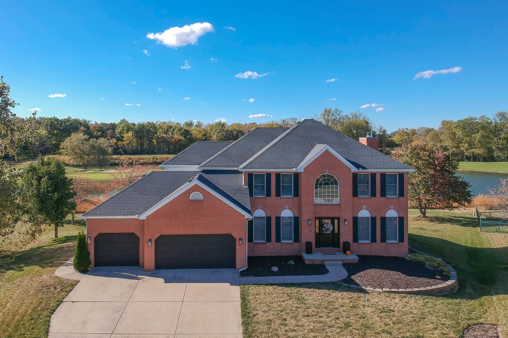 3 Pebblebrook Court Bloomington, IL 61705 - Photo 2 of 89 a front view of a house with a yard and garage